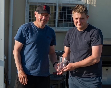 James Greenleaf presents John Weeks (left) with a memento of his 300th consecutive game