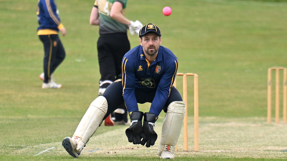 Tavistock keeper Rhys Davies in action behind the stumps