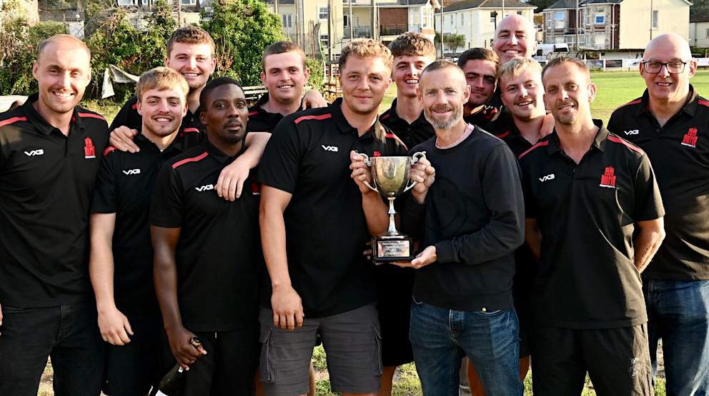 Paignton captain Harry Ward and Chris Read have a hand each on the Tolchards DCL Premier Division trophy<br>credit: Jen Kirkup Paignton captain Harry Ward and Chris Read have a hand each on the Tolchards DCL Premier Division trophy<br>credit: Jen Kirkup