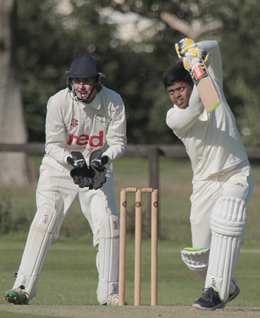 Ivybridge keeper Tom Carpenter can only admire as the ball is smashed through the covers