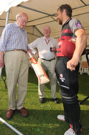 Tony Sutton (left) talking cricket with Somerset's Jamie Hildreth during a testimonial game at South Devon CC in 2017