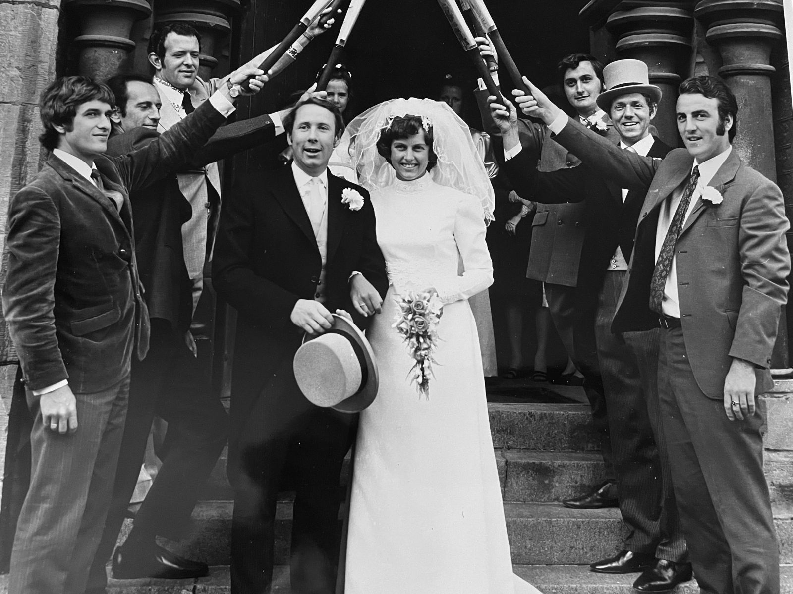 Wellswood team-mates provide a guard of honour for the newly-weds