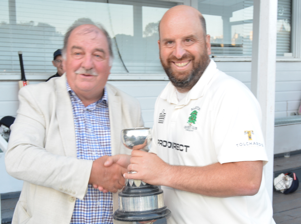 Barton captain Tom Porter receives the Brockman Cup from competition chairman Tim Chapman