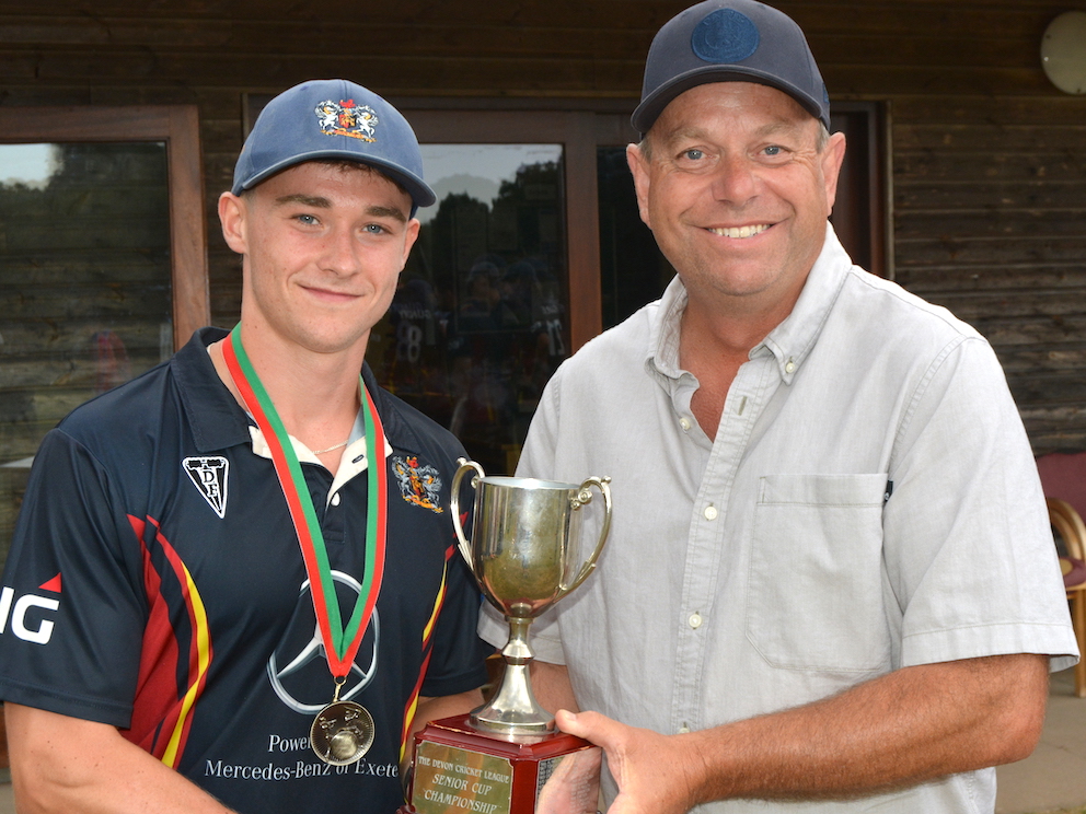 Seb Linnitt collects the Tiflex Devon T20 Cup from competition director Richard Stevenson