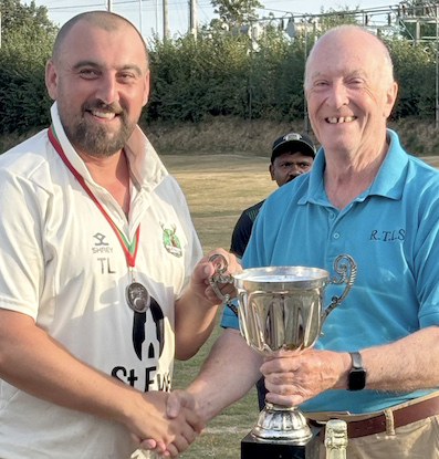 North Molton's Toby Lochead collects the cup from sponsor Richard Tidball (right)